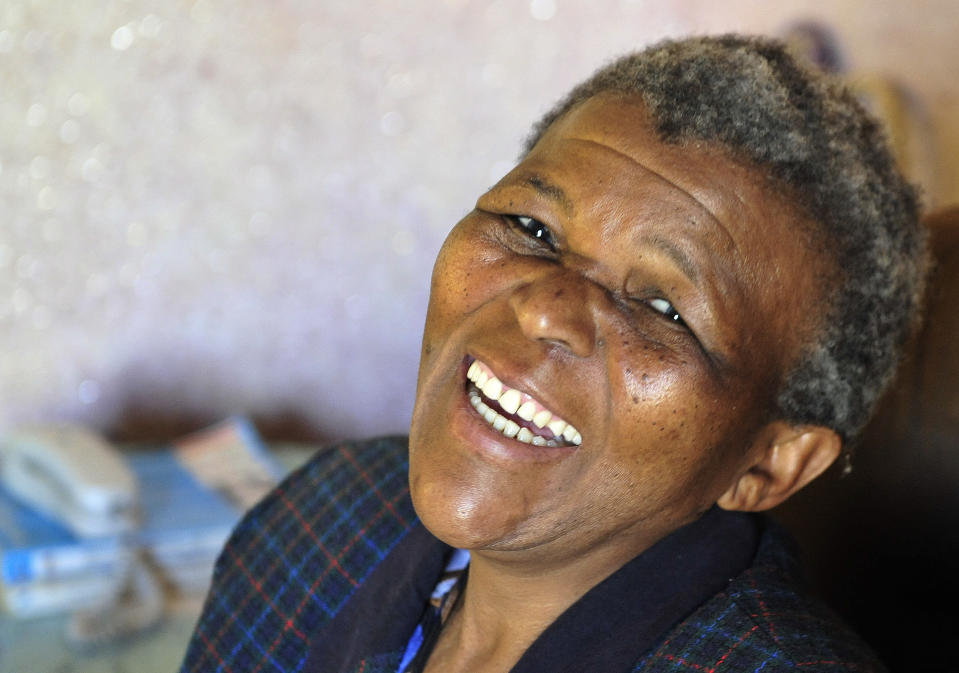 In this photo taken Wednesday, Aug. 11, 2010, Onica Mothoa, alleged to be Nelson Mandela’s daughter at her home in Soshanguve near Pretoria, South Africa. Attorneys for the families of two women who have sought to be recognized as children of Nelson Mandela have contacted the executors of his will. Michael Katz, a lawyer for the executors, said Monday, Feb. 10, 2014 that he had received a letter citing the women's claims, but that it was not a petition for money from the will. The Star, a South African newspaper, has reported that one of the women, Onica Mothoa, says she does not care about the anti-apartheid leader's inheritance but wants to be recognized as his daughter. The Star reported that the other woman, Mpho Pule, died several years ago. (AP Photo) SOUTH AFRICA OUT NO ARCHIVE