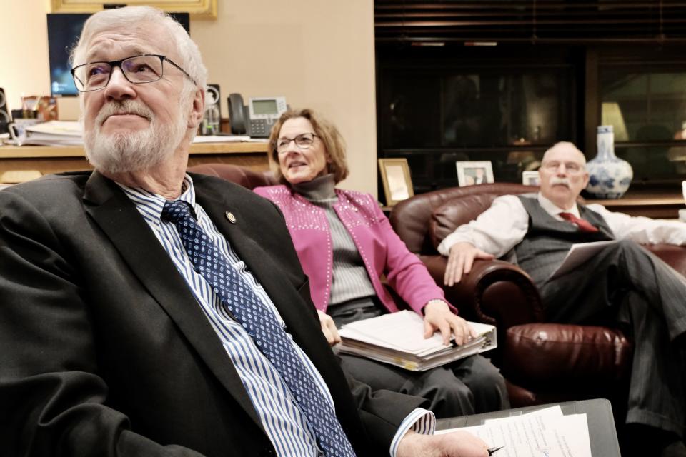 Senate President Gary Stevens, R-Kodiak, Senate Majority Leader Cathy Giessel, R-Anchorage, and Sen. Bert Stedman, R-Sitka, watch the House work to finish business from Stevens' office on May 15, 2024. The House did not adjourn until 1:22 a.m. (Photo by Claire Stremple/Alaska Beacon)