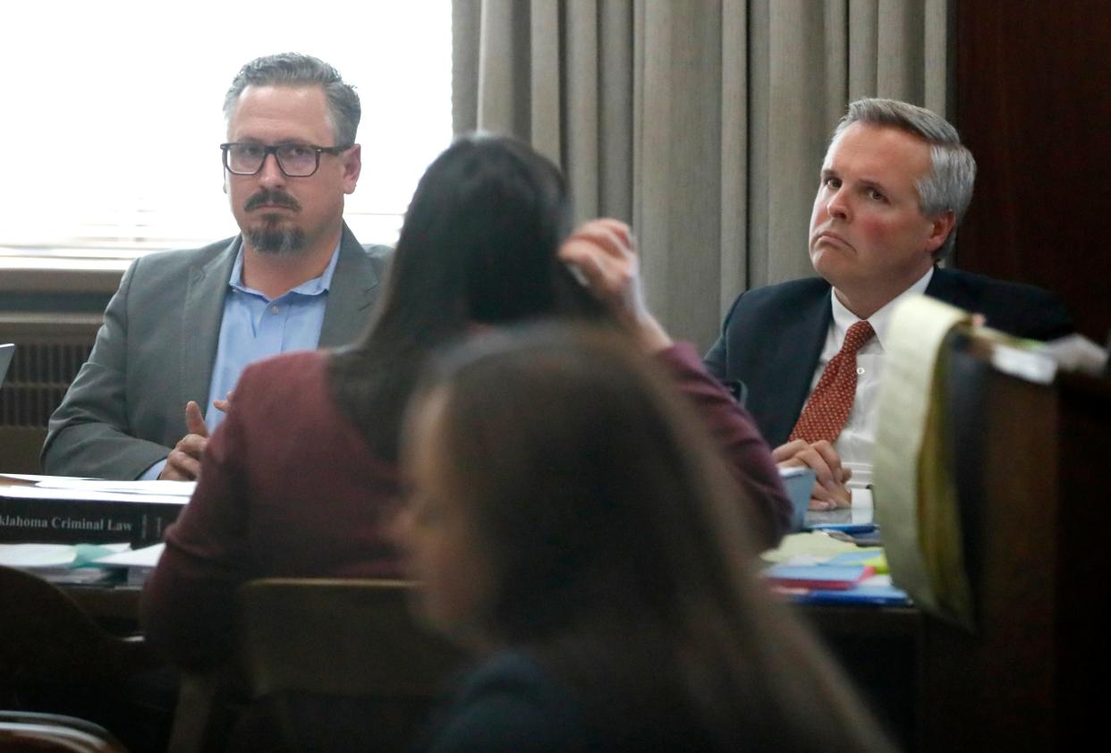 David Chaney, left, and Ben Harris listen to testimony in March at their preliminary hearing in Oklahoma County District Court. They co-founded Epic Charter Schools.