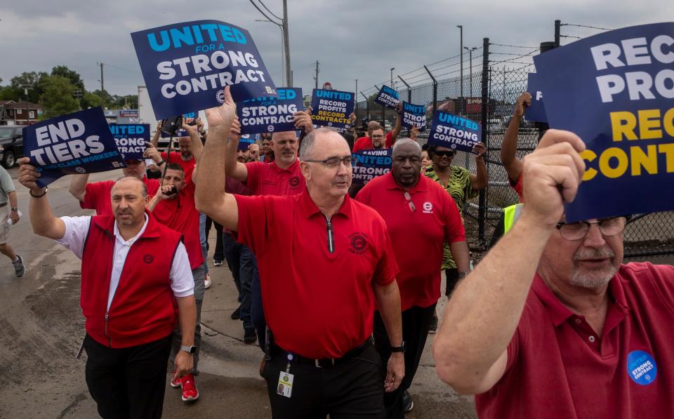 UAW President Shawn Fain walks alongside other union members during a rally and practice picket near the Detroit Assembly Complex - Mack in Detroit on Wednesday, Aug. 23, 2023.