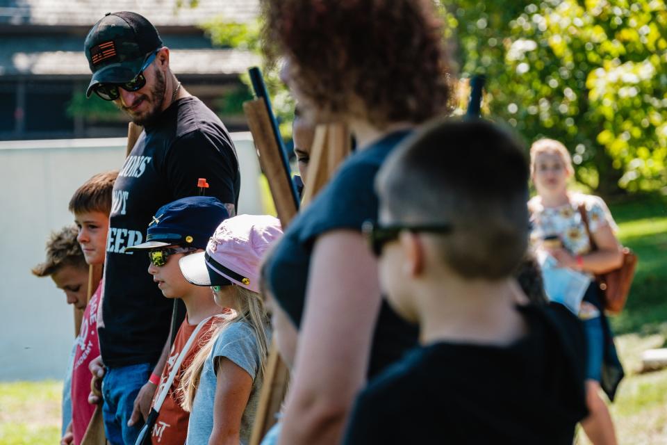 Children learn battlefield rifle etiquette during a Civil War School Days event for school-aged children in Zoar.