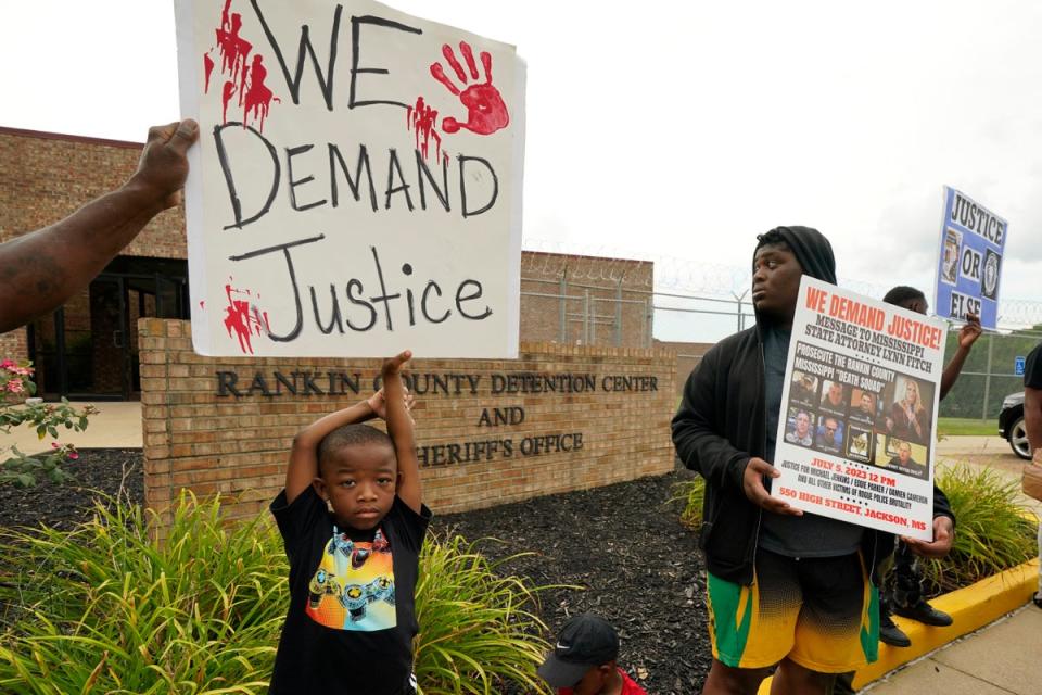 An anti-police brutality activist looks back at the entrance to the Rankin County Sheriff’s Office (Copyright 2023 The Associated Press. All rights reserved)