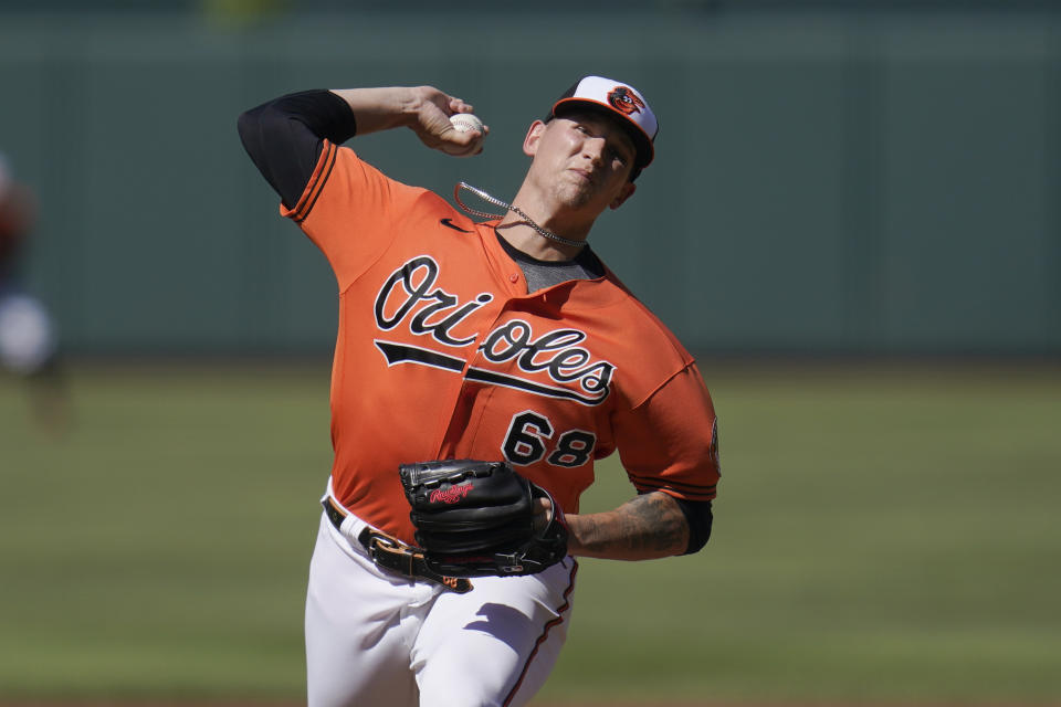 Baltimore Orioles starting pitcher Tyler Wells throws a pitch to the Cleveland Guardians during the first inning of a baseball game, Saturday, June 4, 2022, in Baltimore. (AP Photo/Julio Cortez)