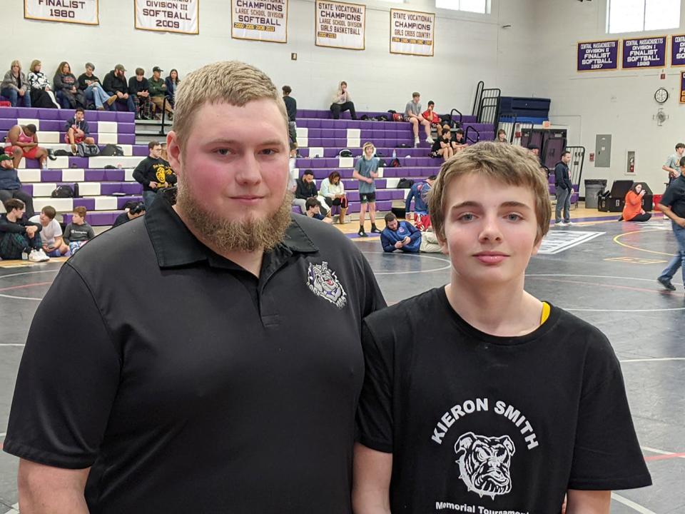 Aastin Smith, left, and Zackary Smith-Pratt, sons of late Monty Tech wrestling coach Kieron Smith, pose for a photo on the mat during Saturday's tournament. Smith-Pratt is a freshman on the Monty Tech wrestling team.