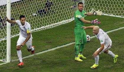 Clint Dempsey (L) celebrates scoring the U.S. team's second goal against Portugal. (AP)