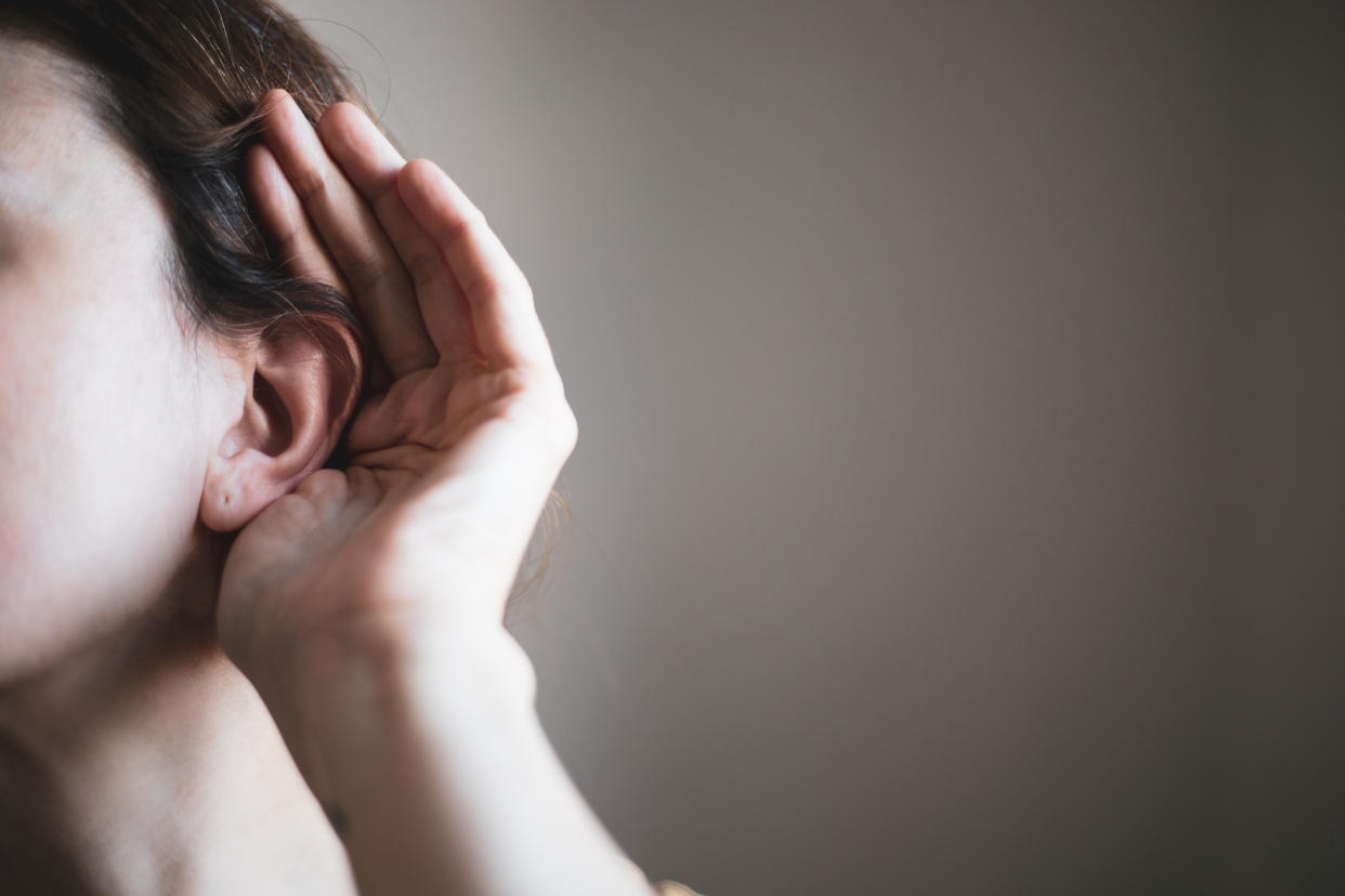 Stock picture of a woman appearing to have hearing loss, Brits are being advised to have hearing tests to help prevent dementia. (Getty Images)