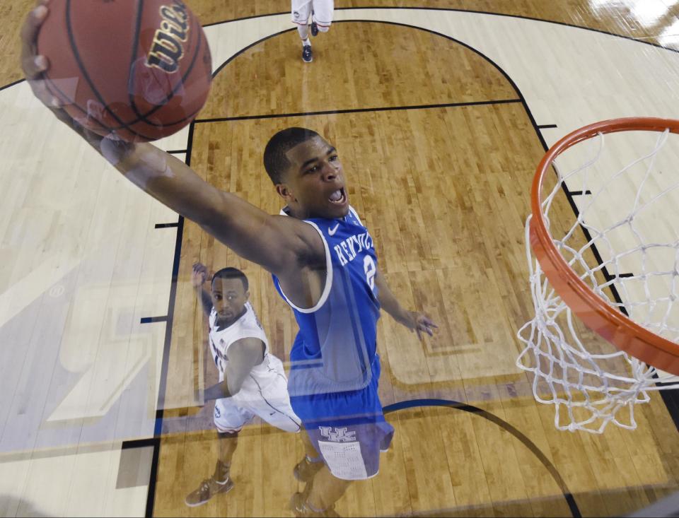 Kentucky guard Aaron Harrison drives to the basket past Connecticut guard Ryan Boatright, rear, during the first half of the NCAA Final Four tournament college basketball championship game Monday, April 7, 2014, in Arlington, Texas. (AP Photo/Chris Steppig, pool)
