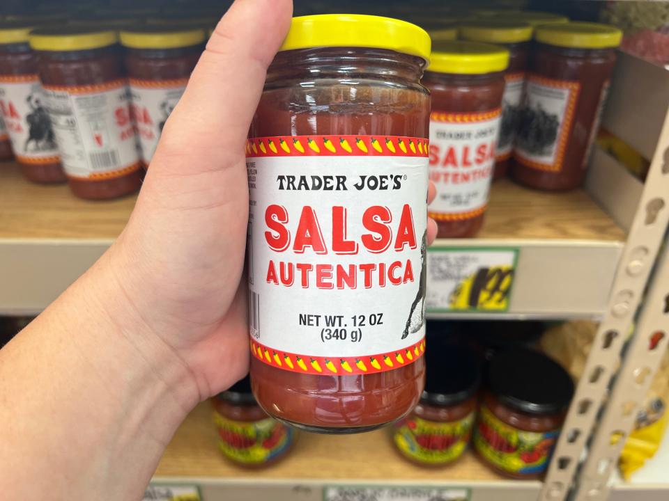 The writer holds a jar of authentic salsa