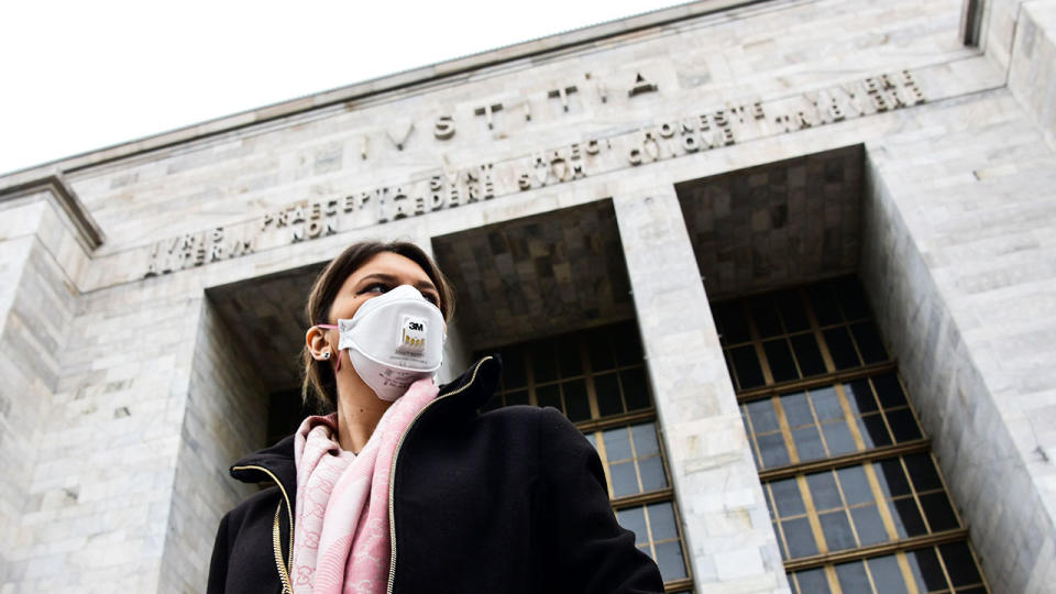 Pictured here, a man in Italy wears a face mask amid the coronavirus threat.
