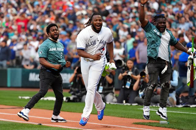 <p>Daniel Shirey/MLB Photos via Getty Images</p> Vladimir Guerrero Jr. celebrates after winning the MLB Home Run Derby in Seattle on July 10, 2023