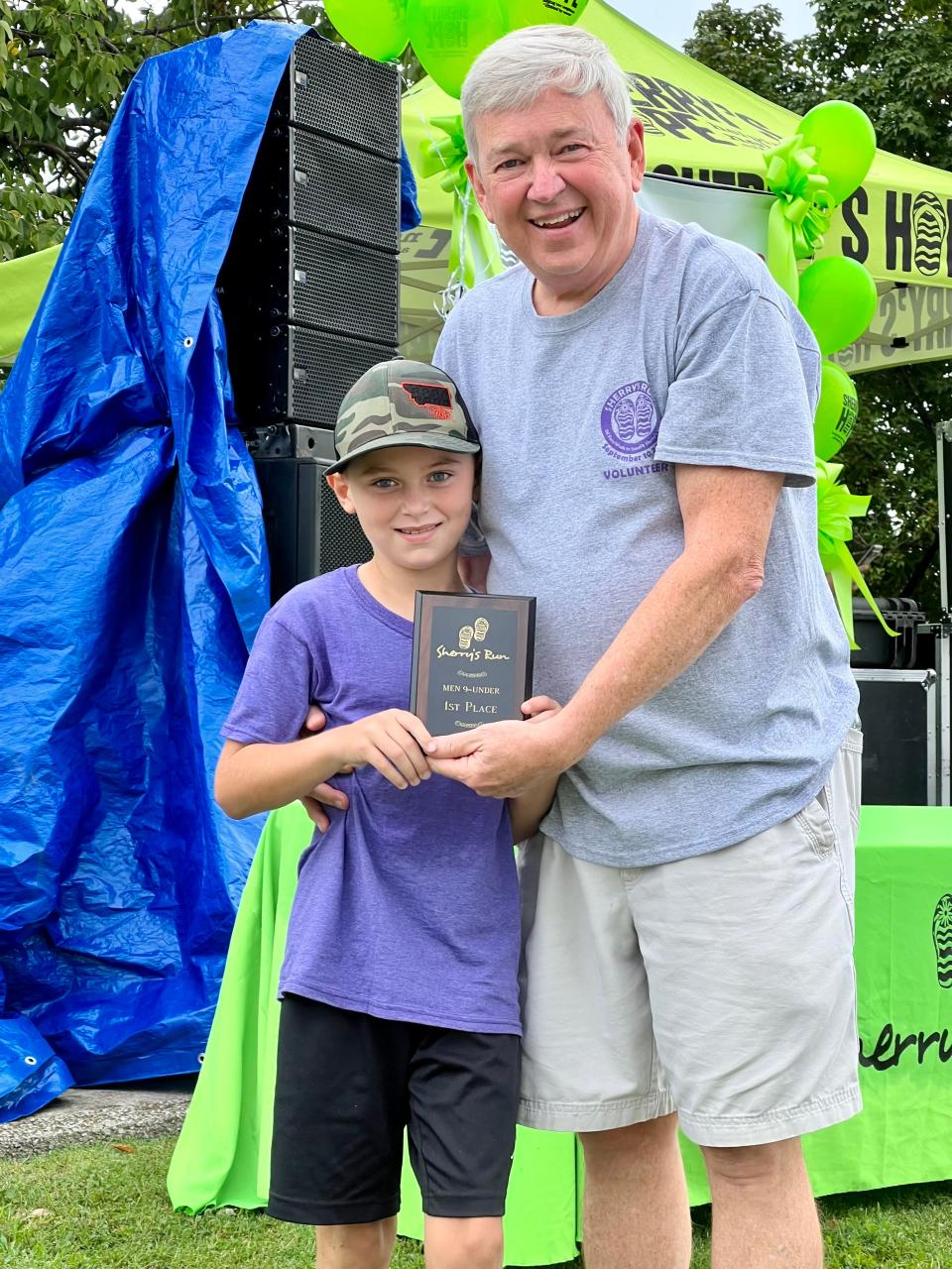 Gary Whitaker, right, with his grandson Carter Whitaker, left. Carter won the 9-under division in 2022 of the Sherry's 5K Run/Walk in Lebanon.