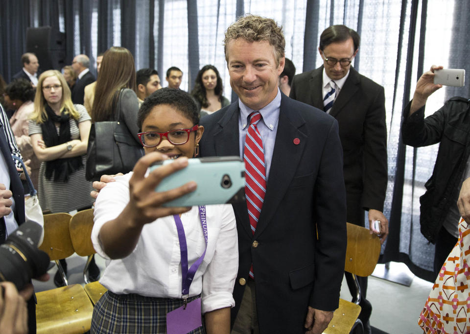 Angelika Noel, 17, poses with Sen. Rand Paul, R-Ky., during a visit to Josephinum Academy in Chicago to participate in a discussion on school choice on Tuesday, April 22, 2014. (AP Photo/Andrew A. Nelles)