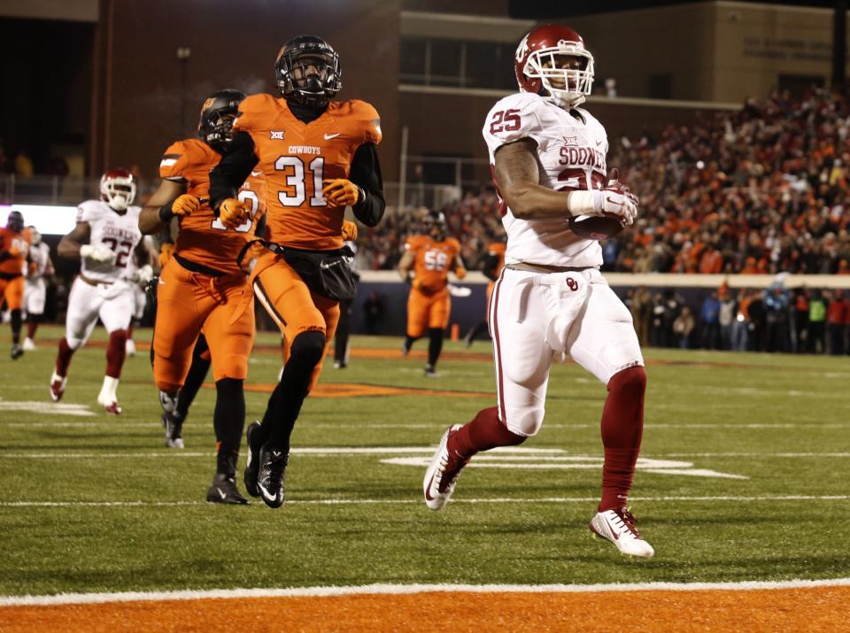 If the Big 12 had a true title game in 2016, the Oklahoma schools would play twice in two weeks. (Getty)