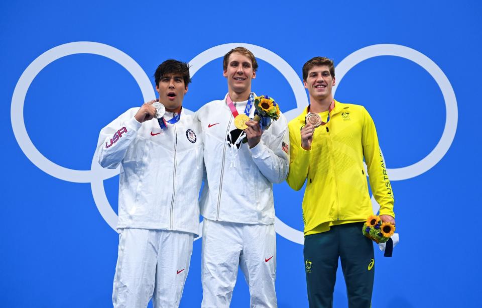 Gold medalist Chase Kalisz C of the United States, silver medalist Jay Litherland L of the United States and bronze medalist Brendon Smith of Australia stand on the podium during the awarding ceremony after the men's 400m individual medley final at the Tokyo 2020 Olympic Games in Tokyo, Japan, July 25, 2021. (Photo by Xu Chang/Xinhua via Getty Images)