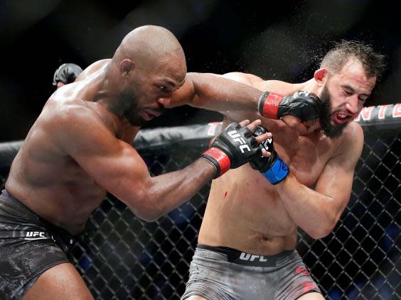 Jon Jones (left) in his last bout, against Dominick Reyes in February (AP)