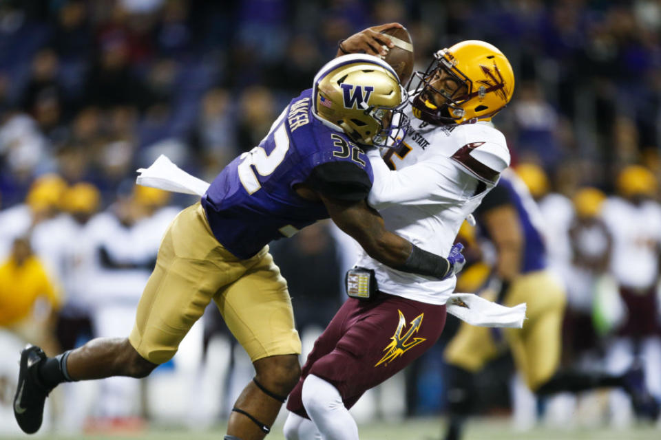 Nov 19, 2016; Seattle, WA, USA; Washington Huskies defensive back Budda Baker (32) sacks Arizona State Sun Devils quarterback Manny Wilkins (5) during the first quarter at Husky Stadium. Mandatory Credit: Jennifer Buchanan-USA TODAY Sports