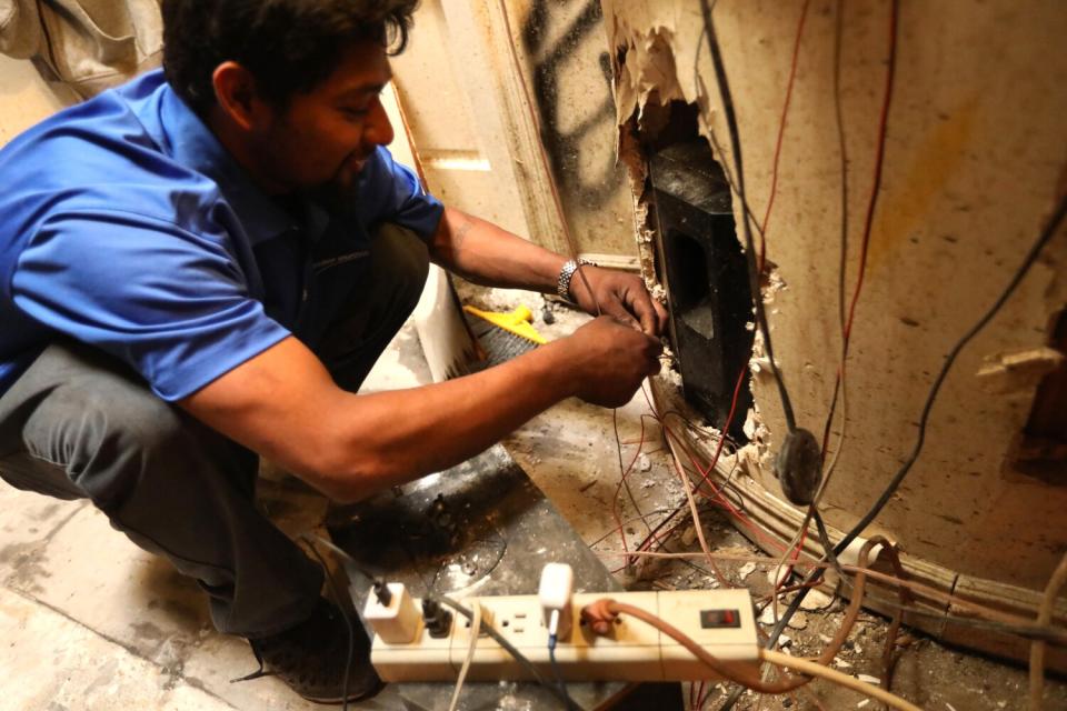 A man connects electric wires