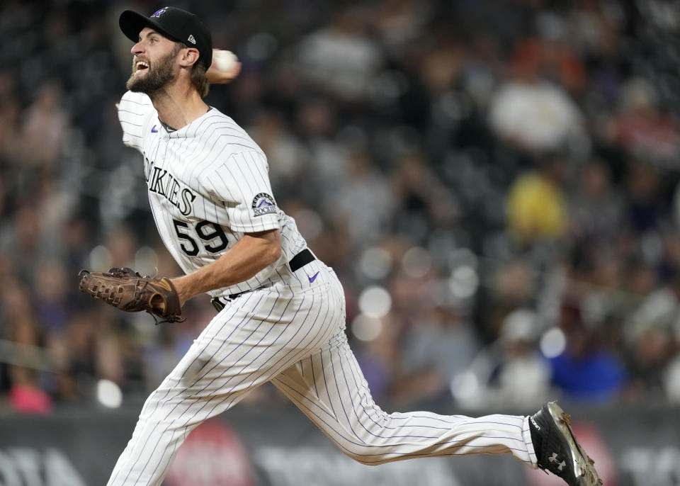 Colorado Rockies relief pitcher Jake Bird works against the San Diego Padres in the ninth inning of a baseball game Friday, June 17, 2022, in Denver. (AP Photo/David Zalubowski)