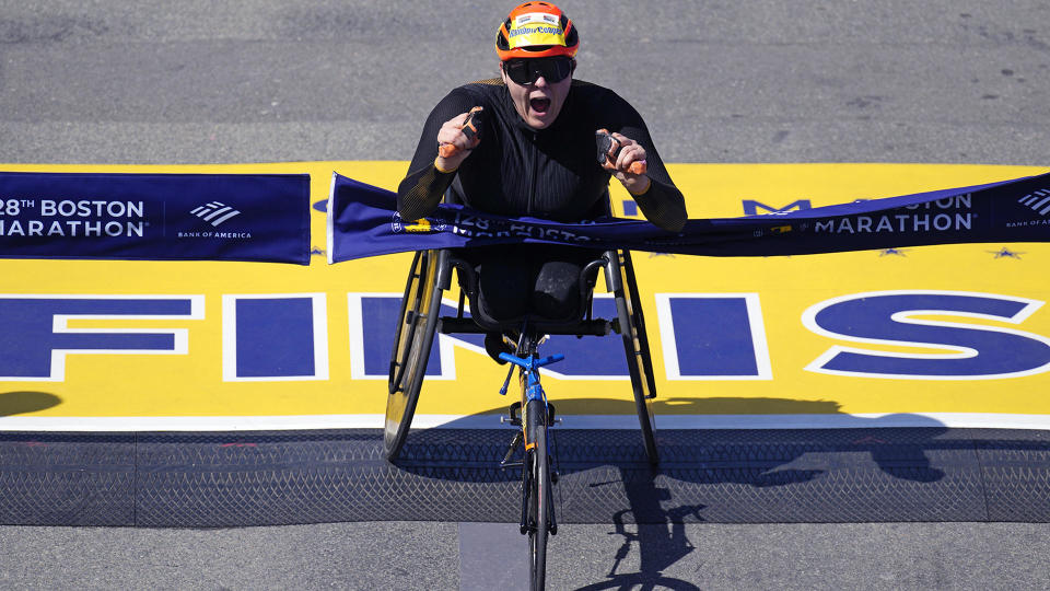 Eden Rainbow Cooper, of Britain, breaks the tape to win the women's wheelchair division at the Boston Marathon, Monday, April 15, 2024, in Boston. / Credit: Charles Krupa / AP