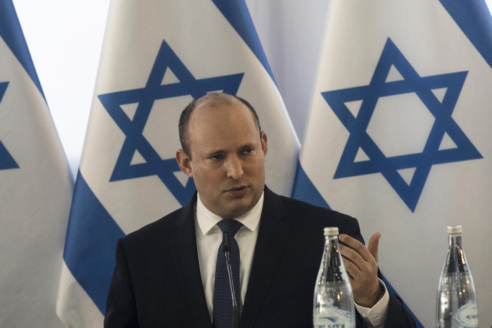 Israeli Prime Minister Naftali Bennett, speaks at the weekly cabinet meeting in Kibbutz Mevo Hama, in the Israeli-occupied Golan Heights, Sunday, Dec. 26, 2021. Bennett said Sunday the country intends to double the amount of settlers living in the Israeli-controlled Golan Heights with a multimillion-dollar plan meant to further consolidate Israel’s hold on the territory it captured from Syria more than five decades ago. (Nir Elias/Pool via AP)