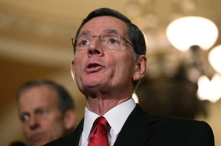 FILE PHOTO: U.S. Senator John Barrasso (R-WY) addresses Capitol Hill reporters following the Senate Republican weekly policy lunch at the U.S. Capitol in Washington, U.S., November 27, 2018. REUTERS/Leah Millis