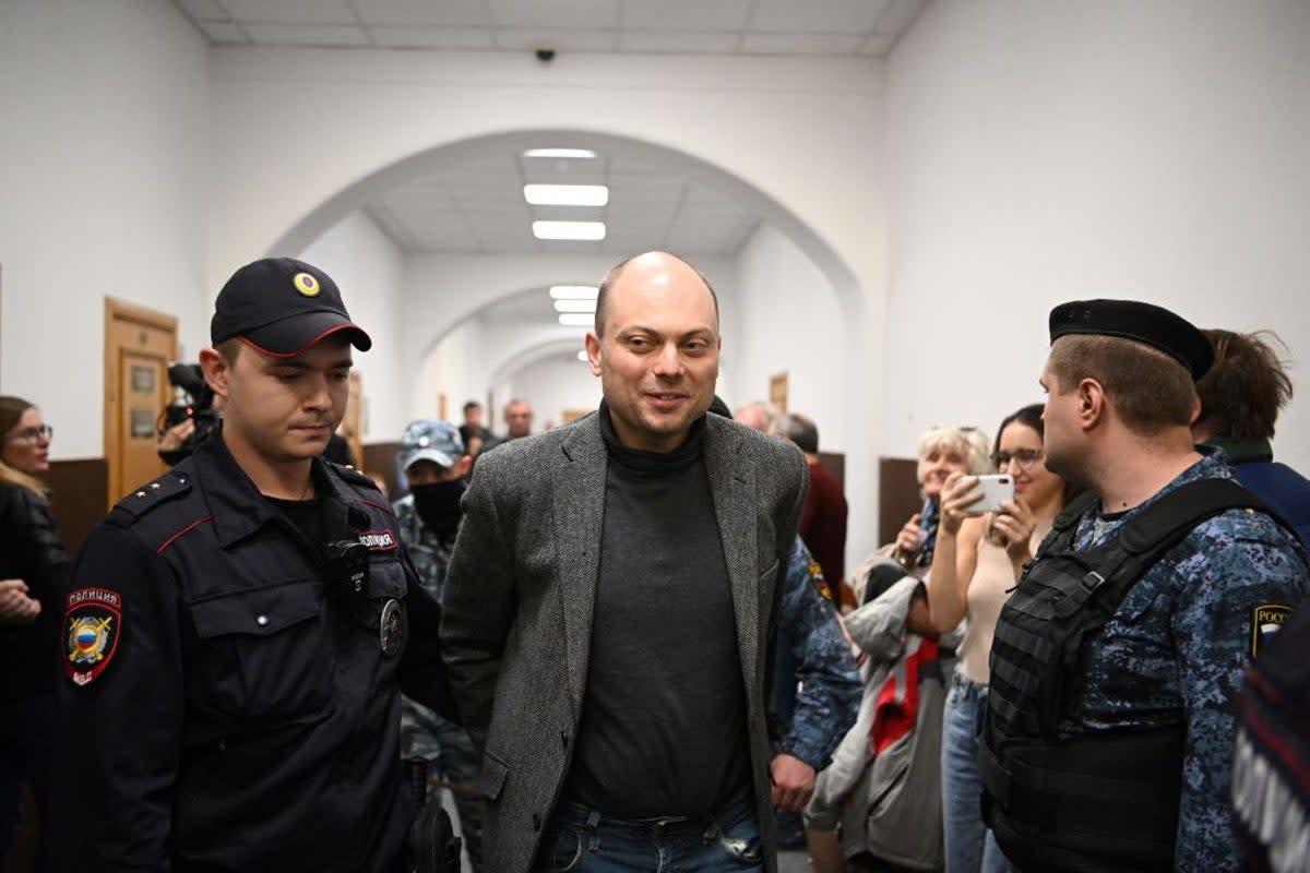 Russian opposition activist Vladimir Kara-Murza is escorted to a hearing at the Basmanny court in Moscow in October 2022 (AFP via Getty)