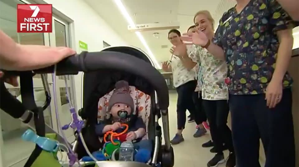 Nursing staff lined up to farewell the brave baby. Source: 7 News