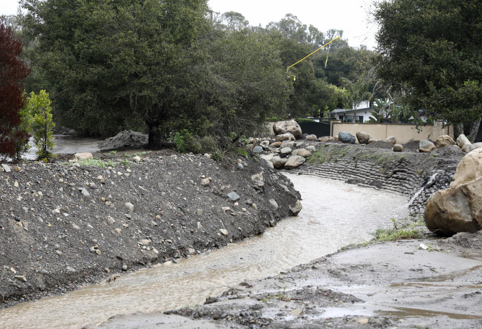 San Ysidro Creek flows steadily after heavy rain in Santa Barbara, Calif., Wednesday, March 6, 2019. A downpour rolled into California with spectacular lightning and thunderclaps Tuesday night in one of the most electric storm systems of the winter. The storm was the latest atmospheric river to flow into California this winter. The National Weather Service reported "copious" lightning strikes as the long plume of Pacific moisture approached the coast on Tuesday. (AP Photo/Daniel Dreifuss)