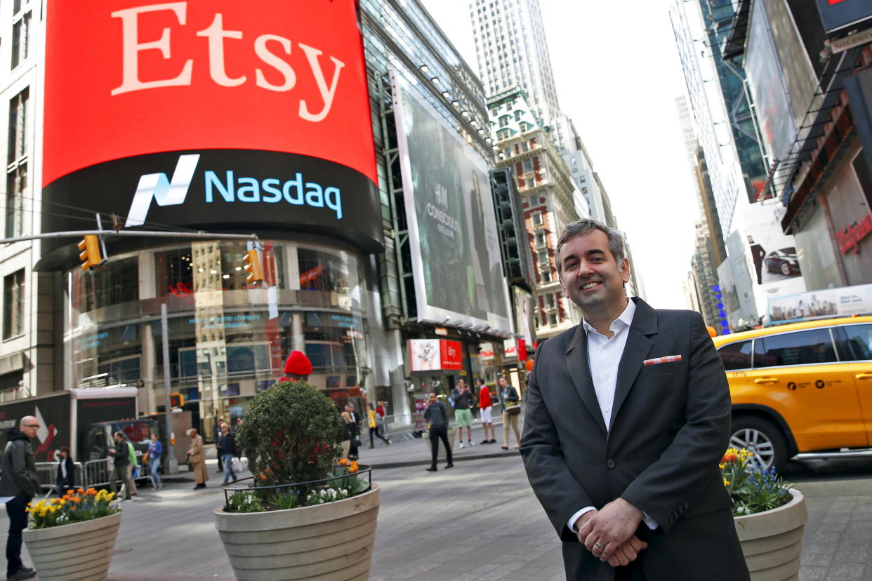 Etsy Inc's Chief Executive Officer Chad Dickerson poses outside the Nasdaq market site in Times Square following Etsy's initial public offering (IPO) in New York April 16, 2015. Etsy's initial public offering has been priced at $16 per share, a market source told Reuters, valuing the online seller of handmade goods and craft supplies at about $1.78 billion.  REUTERS/Mike Segar