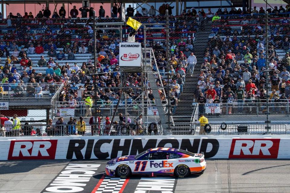 NASCAR Cup Series driver Denny Hamlin (11) completes lap 35 in stage 1 of the Toyota Owners 400 NASCAR Cup Series race at Richmond Raceway on Sunday, April 3, 2022 in Richmond, Va. (AP Photo/Mike Caudill)