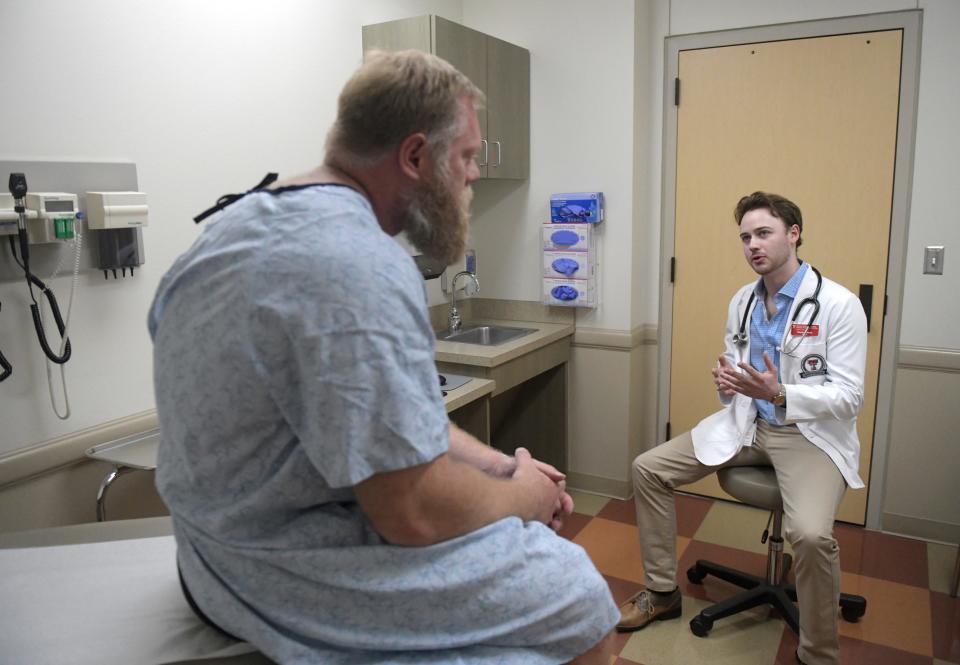 First-year medical student Hayden Meeks speaks with a mock patient at F. Marie Hall SimLife Center, Tuesday, Feb. 27, 2024, at Texas Tech University Health Sciences Center.