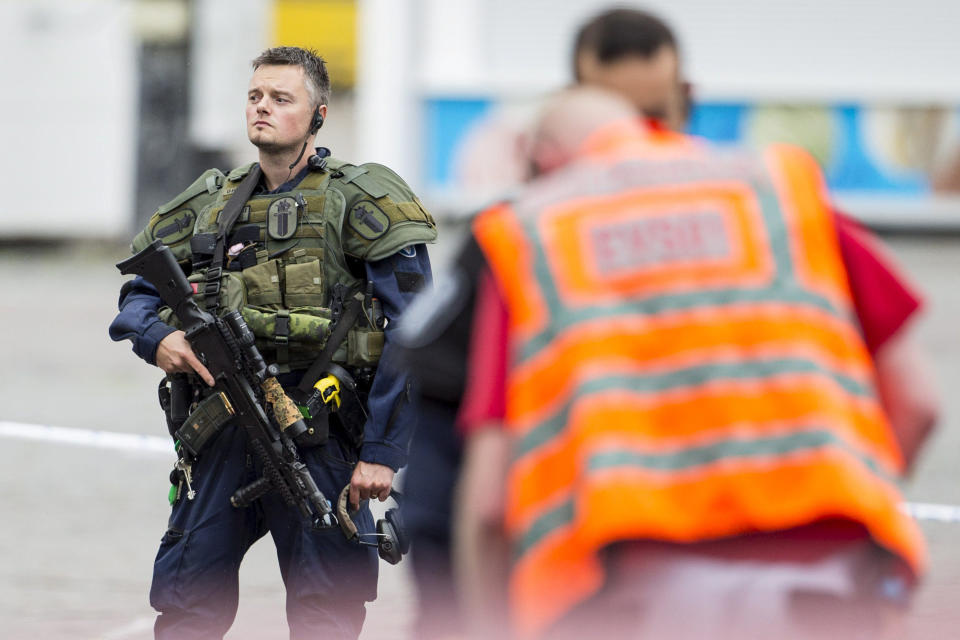 A police officer stands guard at the Turku Market Square.