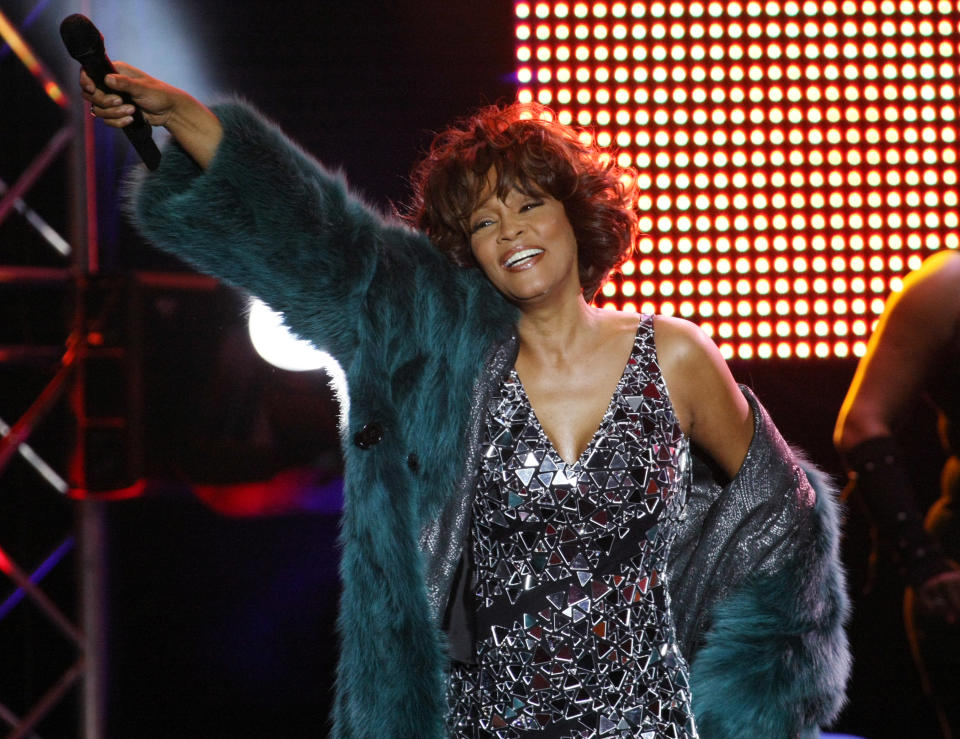 MOSCOW - DECEMBER 9: Singer Whitney Houston performs on stage at Olympisky Sports Complex on  December 9, 2009 in Moscow, Russia.  Moscow is the first city in her world-wide 2009-2010 tour. (Photo by Epsilon/Getty Images)