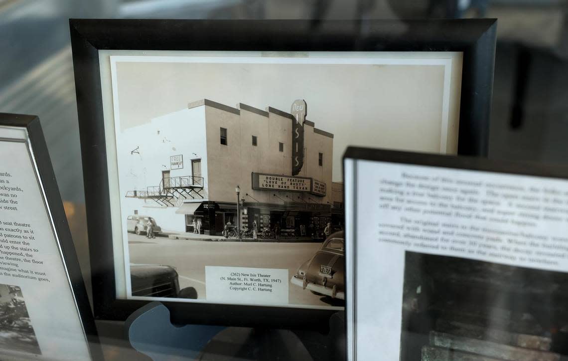 Historic photographs of the the Isis Theatre are displayed in the original ticket booth on Tuesday, August 9, 2022.
