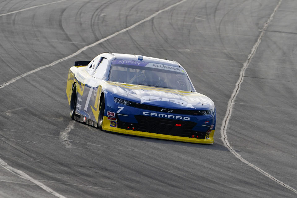 FILE - Justin Allgaier takes his Camaro through its paces as he drives in the NASCAR Xfinity Series auto race at Pocono Raceway, July 23, 2022, in Long Pond, Pa. The Chevrolet Camaro, for years the dream car of many teenage American males, is going out of production. General Motors, which sells the brawny muscle car, said Wednesday, March 22, 2023, that it will stop making the current generation early next year. (AP Photo/Matt Slocum)