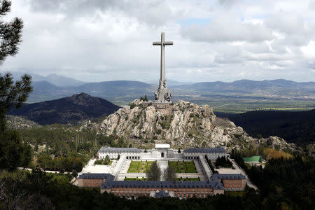 FILE PHOTO: The 150-metre-high cross of the Valle de los Caidos (Valley of the Fallen) monument where over 30,000 fighters from both sides of Spain's civil war are buried, is seen in San Lorenzo de El Escorial, outside Madrid, Spain, May 11, 2016. REUTERS/Paul Hanna/File Photo