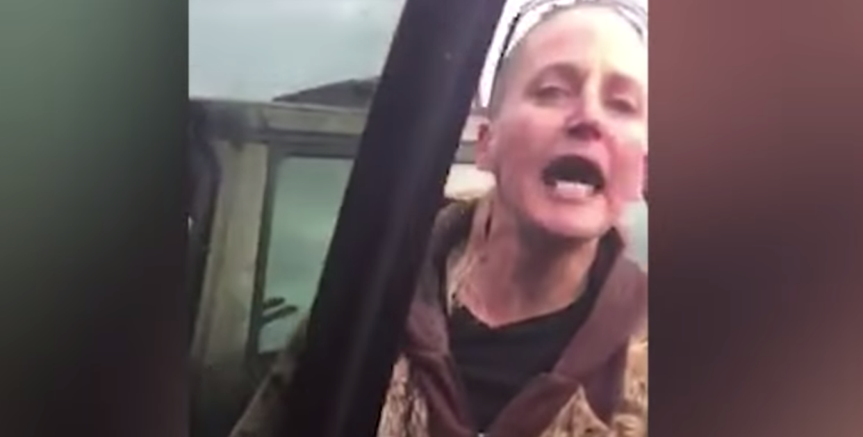 A knife-wielding woman in McMinnville, Ore., is shown threatening a black family in a parking lot. (Photo: YouTube)