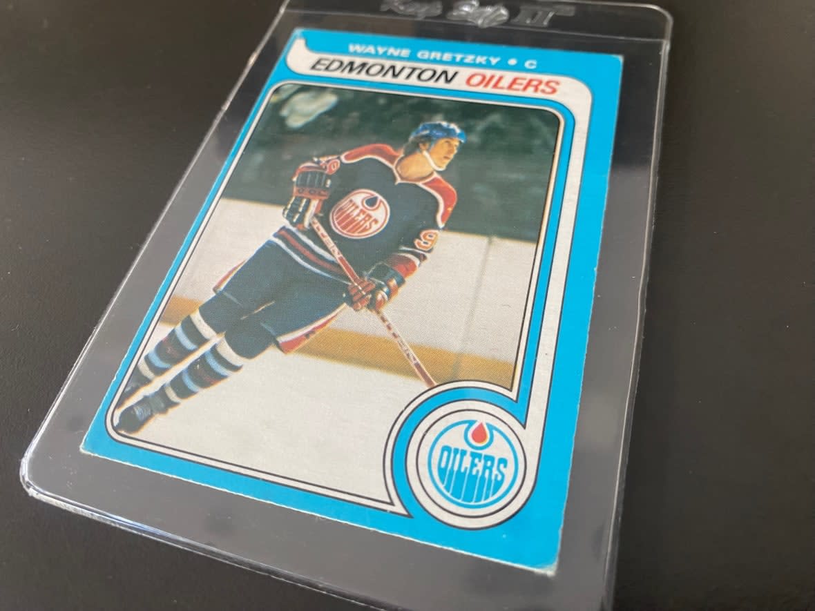 A Saskatchewan family is selling a case full of unopened 1979 hockey card boxes, and bidding has topped $2 million. The boxes contain an unknown number of Wayne Gretzky rookie cards like this one. (Jason Warick/CBC - image credit)