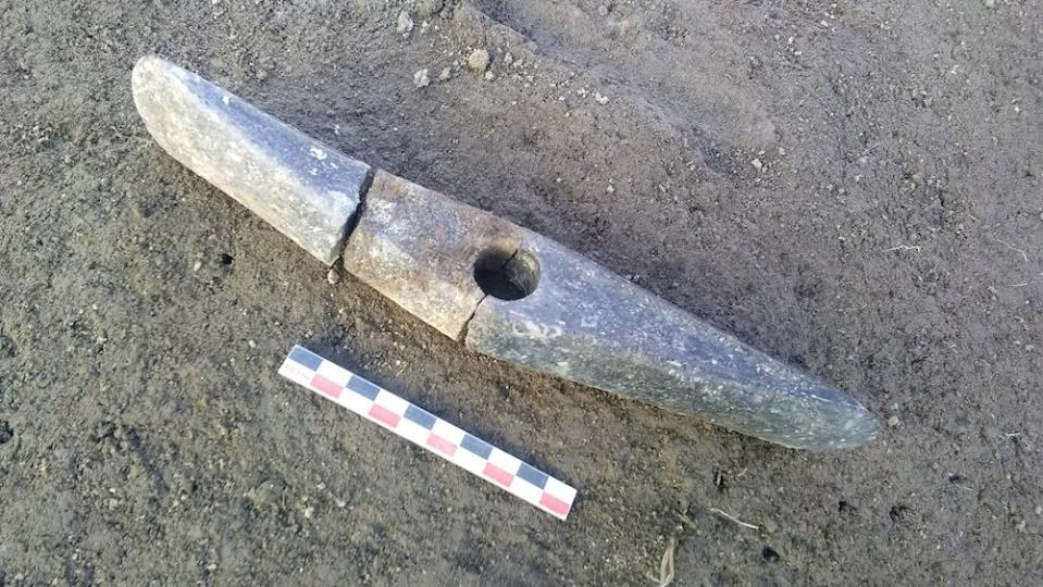An ax broken into three pieces