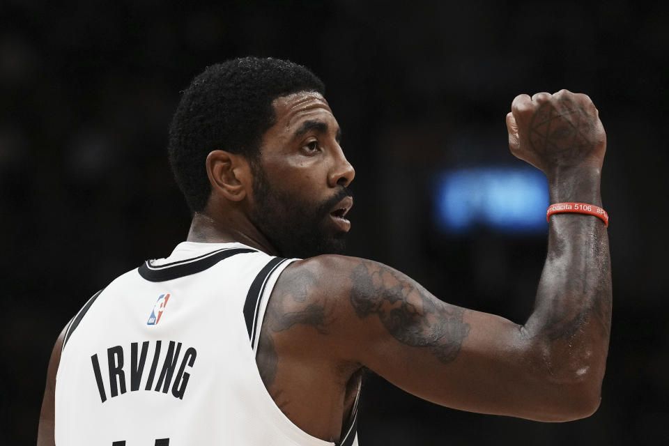 Brooklyn Nets guard Kyrie Irving celebrates a basket against the Toronto Raptors during the second half of an NBA basketball game Wednesday, Nov. 23, 2022, in Toronto. (Chris Young/The Canadian Press via AP)