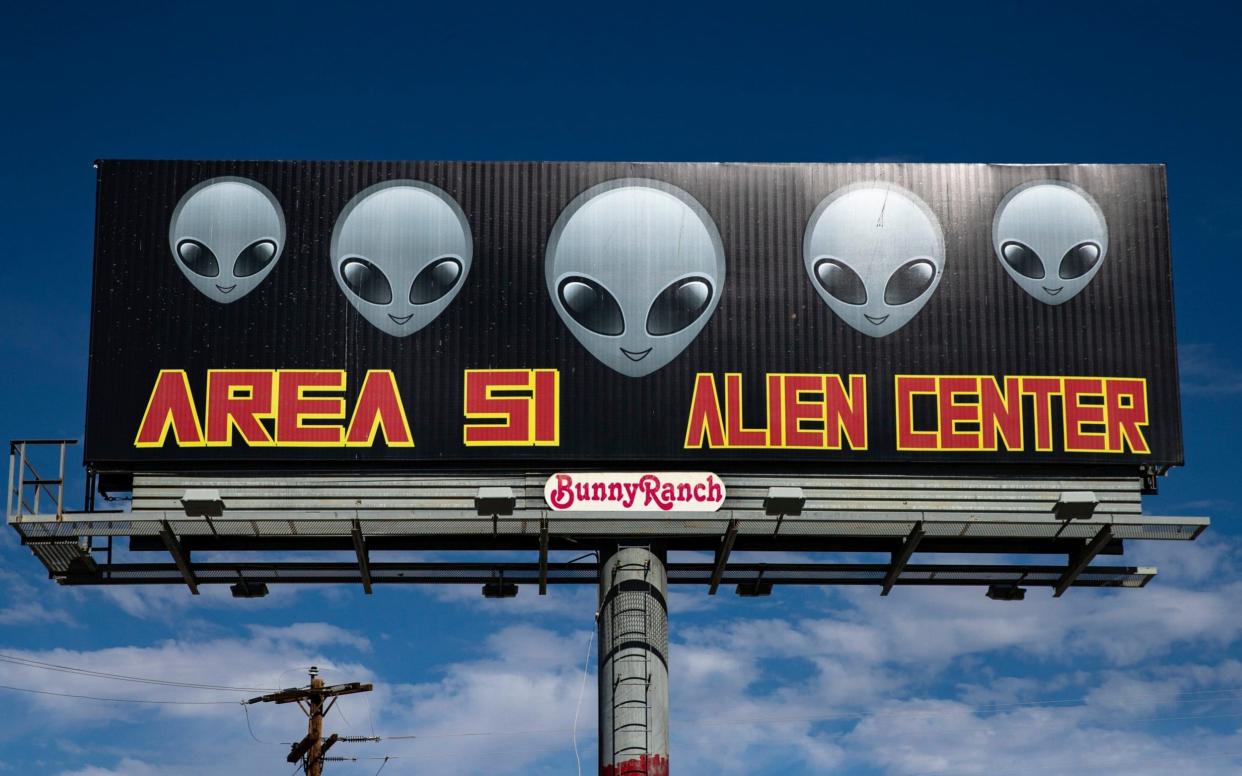 A sign reads 'Area 51 Alien Center' in front of the eponymous building, where more than 1,5 million people have decided to gather to 'storm' the Area 51 - REX