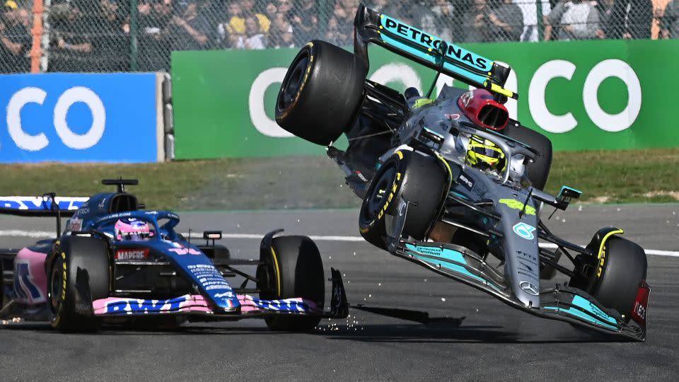 The last couple of seasons have been a bumpy ride for Hamilton, pictured here colliding with Fernando Alonso in 2022. - John Thys/AFP via Getty Images