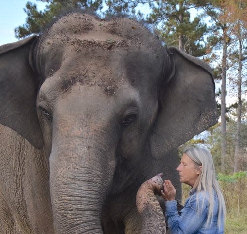 Tarra and Carol Buckley embrace at Elephant Refuge North America in Attapulgus, Georgia.