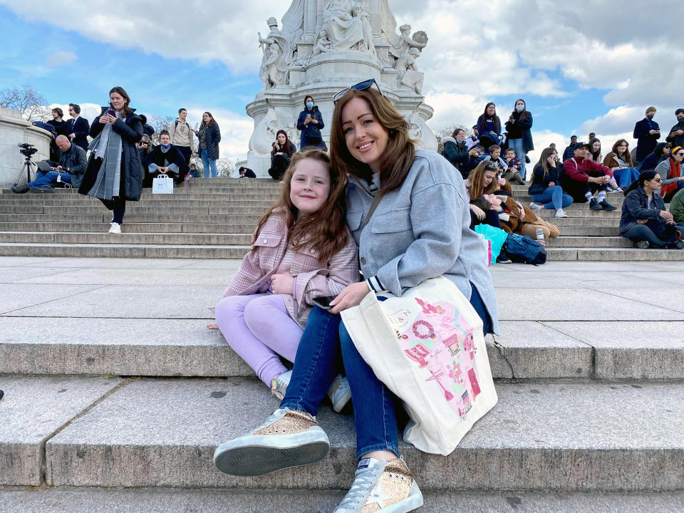 Emma Bedford,42, who came to lay flowers against the palace railings with her five-year-old daughter Evie (Saphora Smith / NBC News)