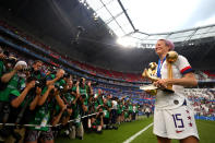 LYON, FRANCE - JULY 07: Megan Rapinoe of the USA celebrates with the FIFA Women's World Cup Trophy, the Golden Boot and The Golden Ball following the 2019 FIFA Women's World Cup France Final match between The United States of America and The Netherlands at Stade de Lyon on July 07, 2019 in Lyon, France. (Photo by Catherine Ivill - FIFA/FIFA via Getty Images)