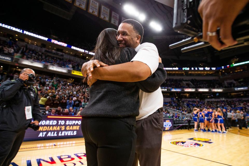 Washington head coach Steve Reynolds hugs his wife and assistant coach Marcy Reynolds after winning the Washington vs. Silver Creek girls state championship basketball game Saturday, Feb. 26, 2022 at Gainbridge Fieldhouse in Indianapolis. 