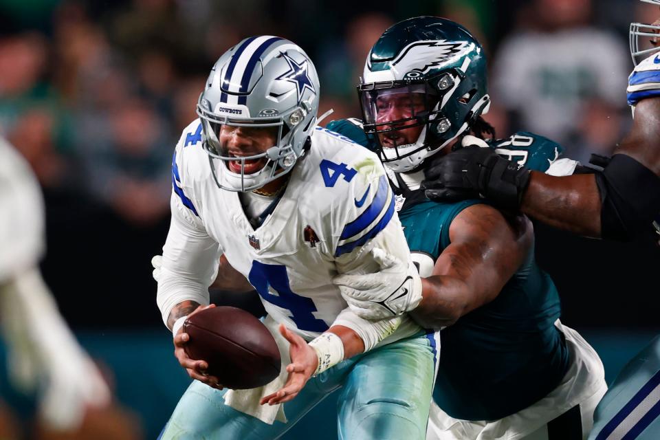 Philadelphia Eagles defensive tackle Jalen Carter (98) sacks Dallas Cowboys quarterback Dak Prescott (4) during the fourth quarter of an NFL football game, Sunday, Nov. 5, 2023, in Philadelphia.