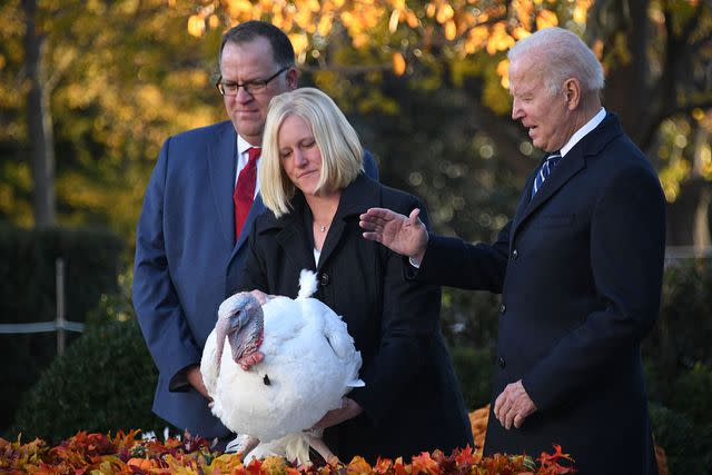 OLIVIER DOULIERY/AFP via Getty Joe Biden and a turkey