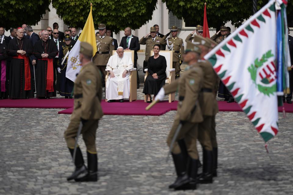 Pope Francis sits beside Hungary President Katalin Novák in the square of "Sándor" Palace in Budapest, Friday, April 28, 2023. The Pontiff is in Hungary for a three-day pastoral visit. (AP Photo/Andrew Medichini)