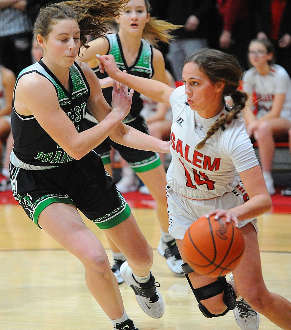 Salem's Abbie Davidson is defended by West Branch's Sophia Gregory in an Eastern Buckeye Conference game Saturday, January 22, 2022 at Salem High School.